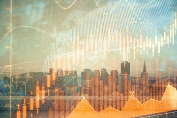 Forex graph on city view with skyscrapers background multi exposure. Financial analysis concept.