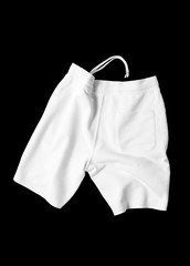 White shorts on a black background cut out. Mock-up.