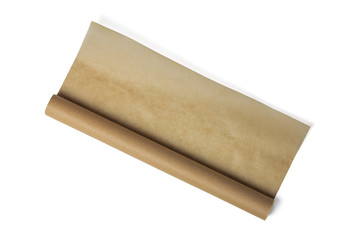 Baking paper roll isolated on white background. Brown parchment in a roll. Baking paper roll