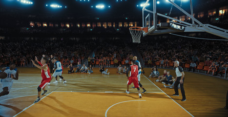 Fototapeta premium Basketball players on big professional arena during the game. Tense moment of the game. Celebration