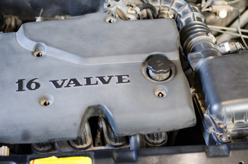 Fototapeta premium View of parts under the hood of a car. Car motor