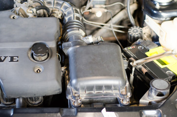 View of parts under the hood of a car