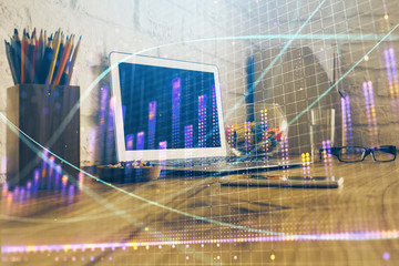 Fototapeta na wymiar Double exposure of graph and financial info and work space with computer background. Concept of international online trading.