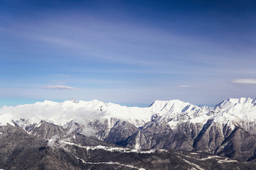 Fototapeta na wymiar snow mountains, blue sky winter ski resort