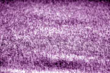 Textile texture with blur effect in purple tone.