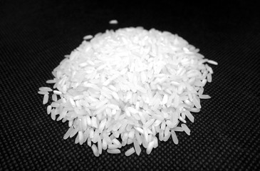 White rice isolated on black in black and white.