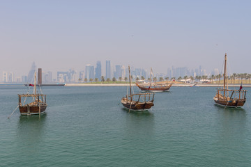 Fototapeta premium Doha, Qatar - located at the Eastern side of the Corniche, the Dhow Harbour is one of the main landmarks of Doha, and show a full display of traditional boats and vessels