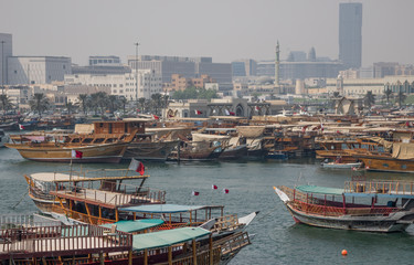 Doha, Qatar - located at the Eastern side of the Corniche, the Dhow Harbour is one of the main landmarks of Doha, and show a full display of traditional boats and vessels
