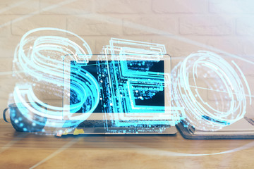 Multi exposure of table with computer and seo drawing hologram. Search optimization concept.