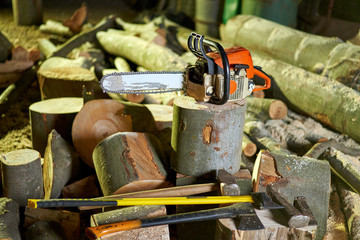 Lumberjack tools on logs in the night