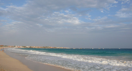 tourists enjoy walking along the tropical beaches in Cape Verde on Sal Island