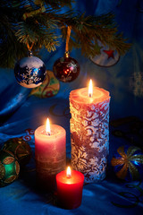 Christmas candles on blue background