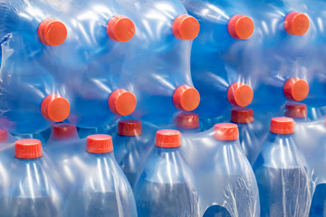 Water in plastic bottles.