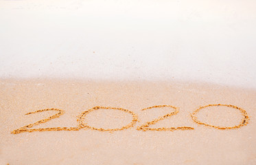 2020 writing in the sand  beach in the morning, appropriate the Backdrop idea copy space