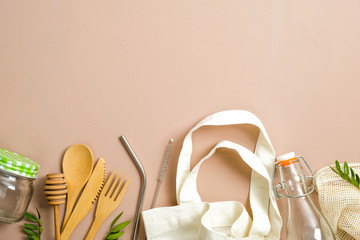 Set of Eco friendly bamboo cutlery, canvas shopping bag, eco drinking straws, glass milk bottle and jar. Zero waste, plastic free concept. Sustainable lifestyle.