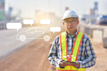 Fototapeta premium Senior Engineering holding tablet data technology working on road construction site