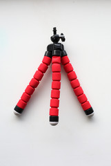 Red flexible tripod for mobile phones.