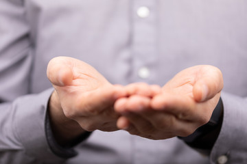 Businessman without head holding something without theme
