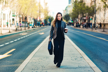 Happy beautiful professional business woman on street