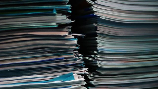 Stacks of old documents in the old archive. Brown, old data files.