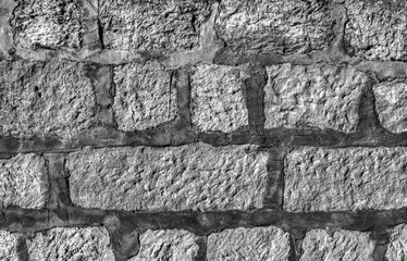 Stone wall background in black and white close up view