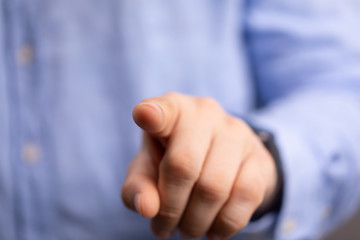 Hand pushing on a touch screen.