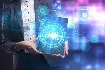 Business, Technology, Internet and network concept. Young businessman working on a virtual screen of the future and sees the inscription: Ddos attack