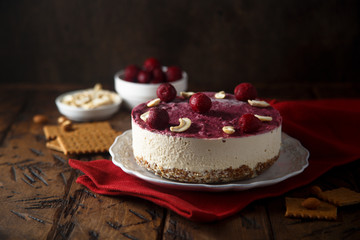 Raw vegan cheesecake with cherry and cashew nuts