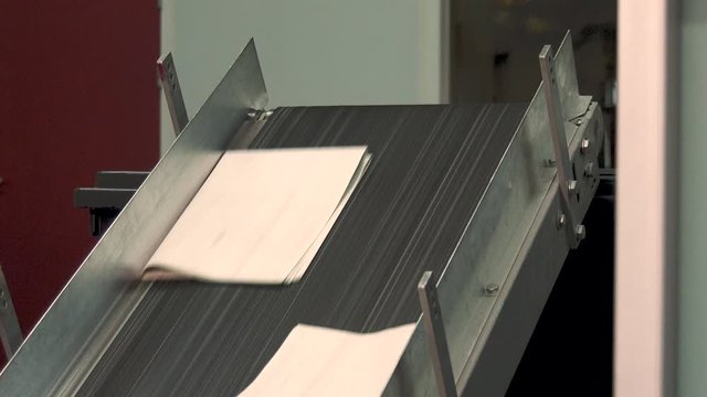 Throwing away bad printed newspapers via assembly line in printing factory