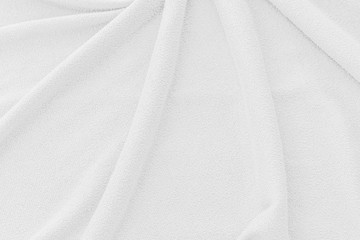 Fototapeta premium White fabric texture background. Abstract wave canvas surface.