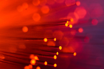Closeup of the glowing tubes. Orange glowing lights on the tips of plastic tubes
