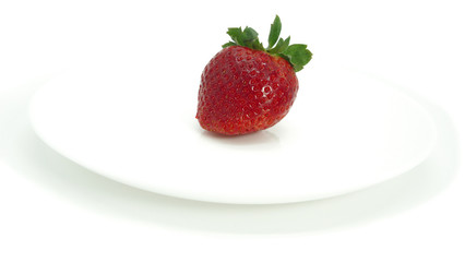 Large, ripe strawberries. Isolated. Juicy dessert, healthy vegetarian food. Bright, colorful breakfast. Strawberries on a white plate, isolated background. Organic, natural food.