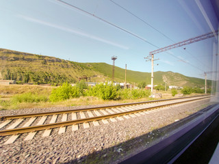 view from the window of a train car passing