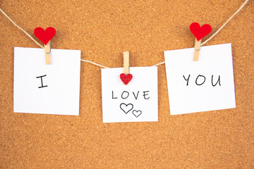 i love you red heart note on cork board