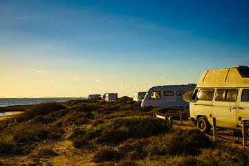 Obraz na płótnie Canvas Camper cars on beach, camping on nature