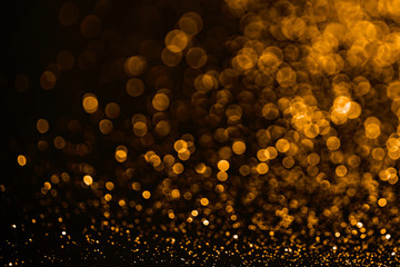 Golden sparkles raster festive background. Bokeh lights with bright shiny effect illustration....