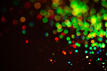 Multicolor glitter raster background. Abstract shimmering red circles on deep purple backdrop. Vibrant bokeh lights effect festive illustration. Overlapping glowing and twinkling spots.