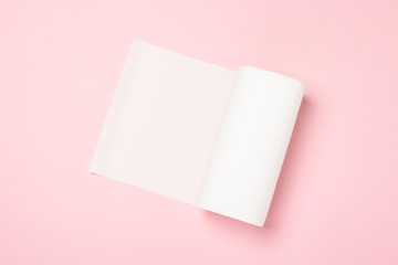 Roll of paper towels on a pink background. Concept is 100 natural product, delicate and soft. Flat...