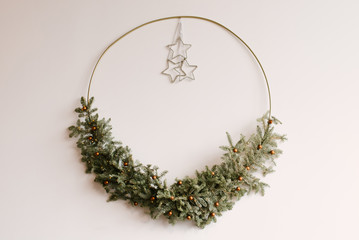 Christmas decor, wreath of spruce hanging on a light background