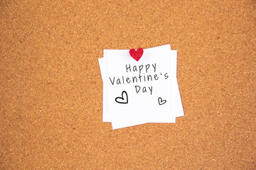 Valentine 's day red heart note on cork board