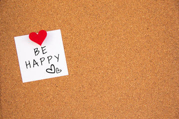 be happy note on cork board