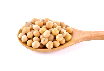 soybeans in wooden spoon on white