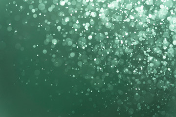 Abstract Green bokeh defocus glitter blur Background.