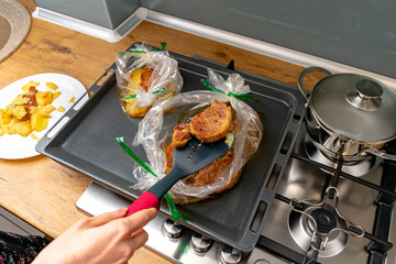 Fried potato slices and pork steaks
