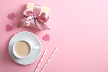Valentine's day composition with gift box, hearts, coffee cup and drink straw on pink background. Flat lay, top view, copy space. Greeting card mockup for Valentine's Day, Happy Women's day