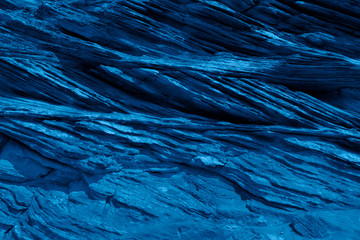 Trend color 2020 classic blue, layout for design. Mountain wall texture in trendy blue color. Trendy color concept of the year, classic blue background. Modern stylish idea for interior design.
