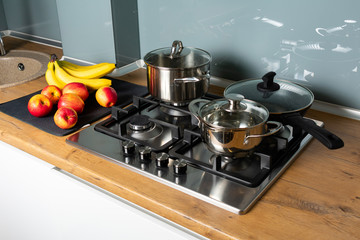 Modern gas stove with stainless steel and pan