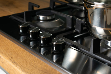 Modern gas stove with stainless steel and pan