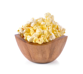 Popcorn in wooden bowl on the white background