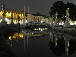 Padova, Italy - October 12th, 2019: Prato della Valle, in Padova, at night. The biggest square in Italy and one of the biggest in Europe, surrounded by a canal of water and by two rings of statues.
